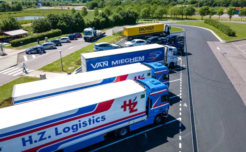 The Essentials of Blogging: Tips and Strategies for Success Aerial image showcasing logistics trucks parked in a rest area.