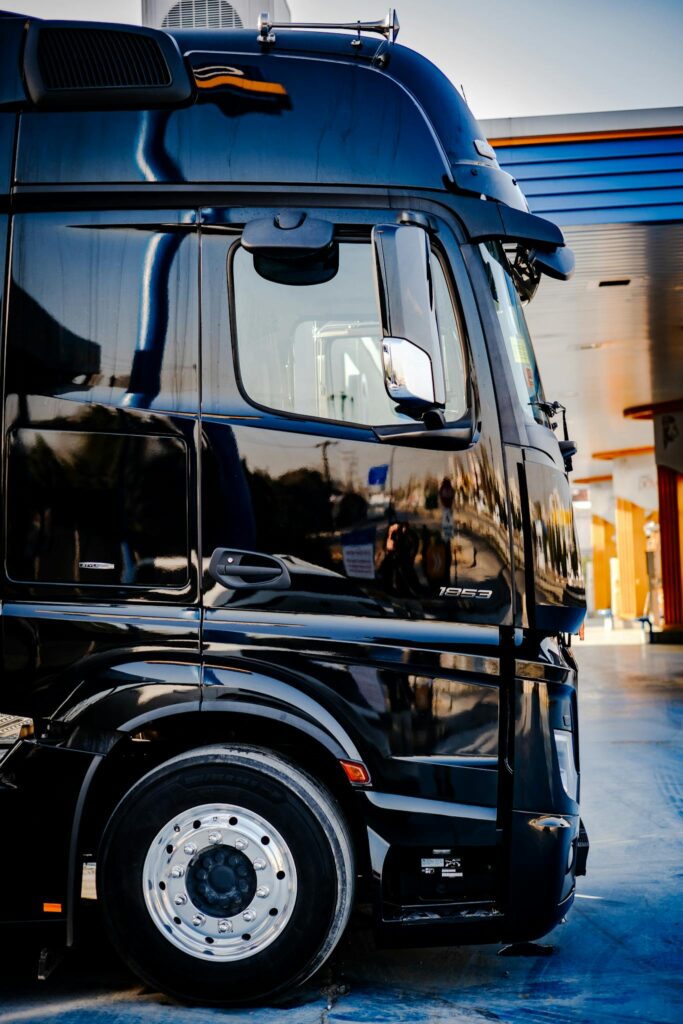 Building a Loyal Blog Audience: Strategies for Engagement and Growth Sleek black truck parked outdoors at a service station during daytime.